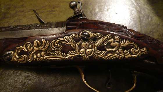 Antique Flintlock pistols, Rifles & Blunderbuss. carvedflintlockdecorativemetalwork